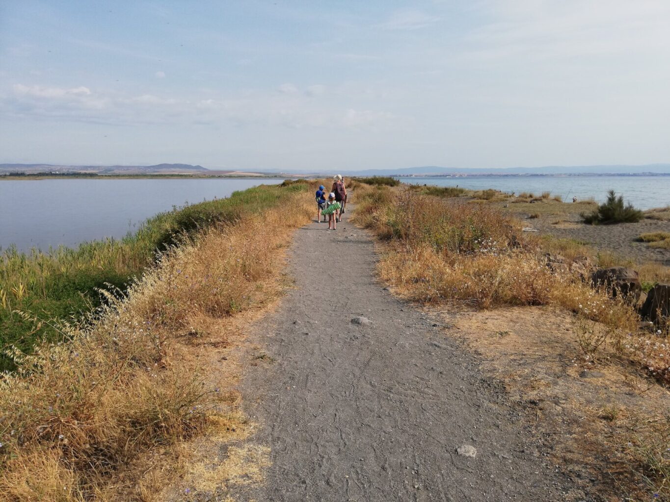 The spit between Pomorie Lake and the Black Sea — a path with the lake on the left and the sea on the right